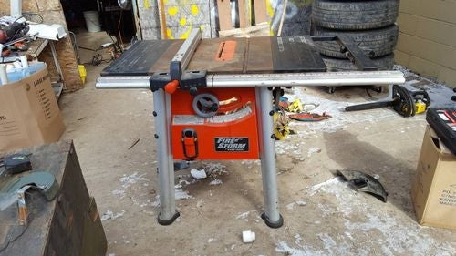 Black and Decker FireStorm 10 table saw with steel floor stand and dust  collection bag. Table with